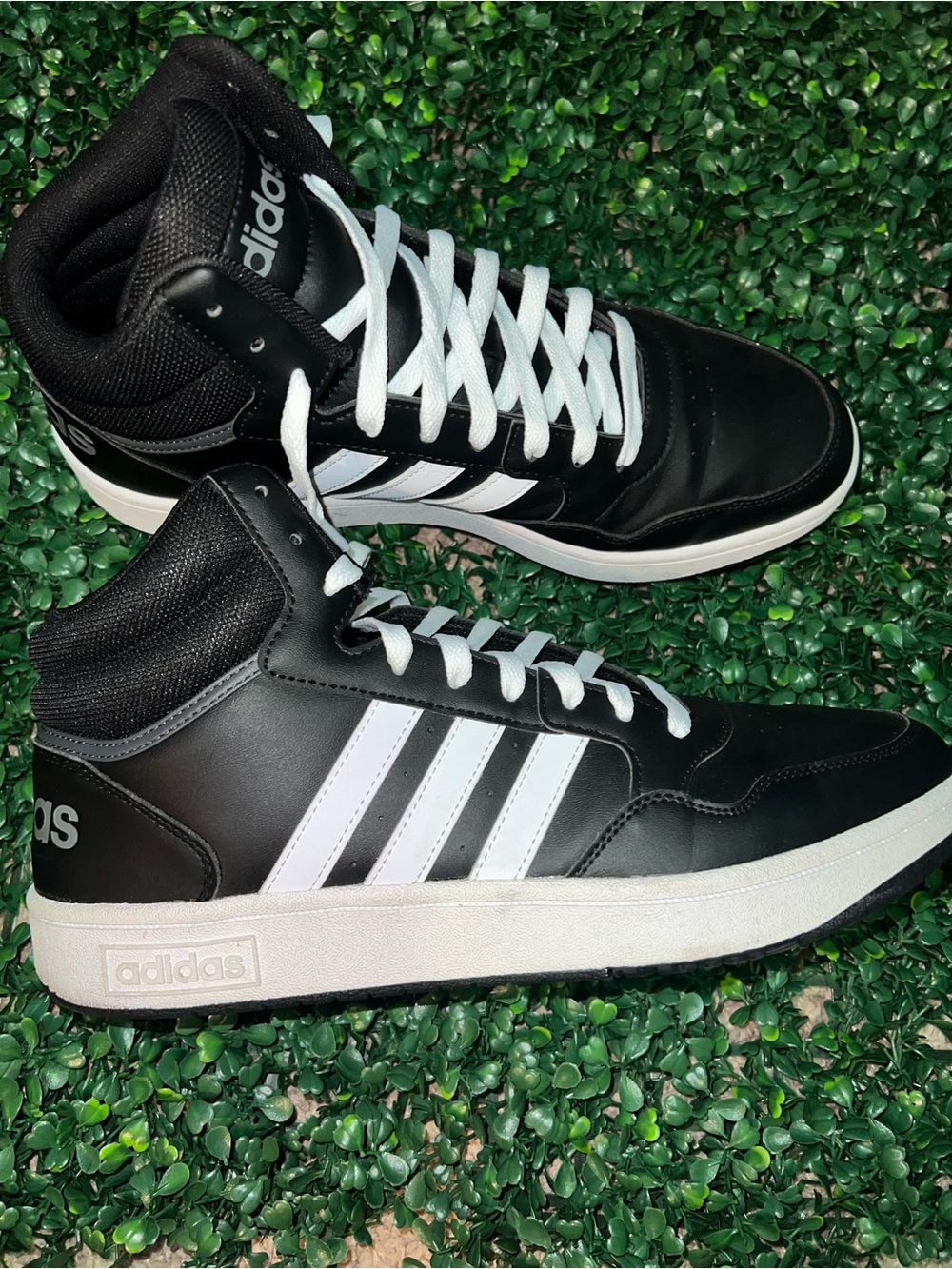 Adidas Black and White High-Top Sneakers with Iconic Three Stripes